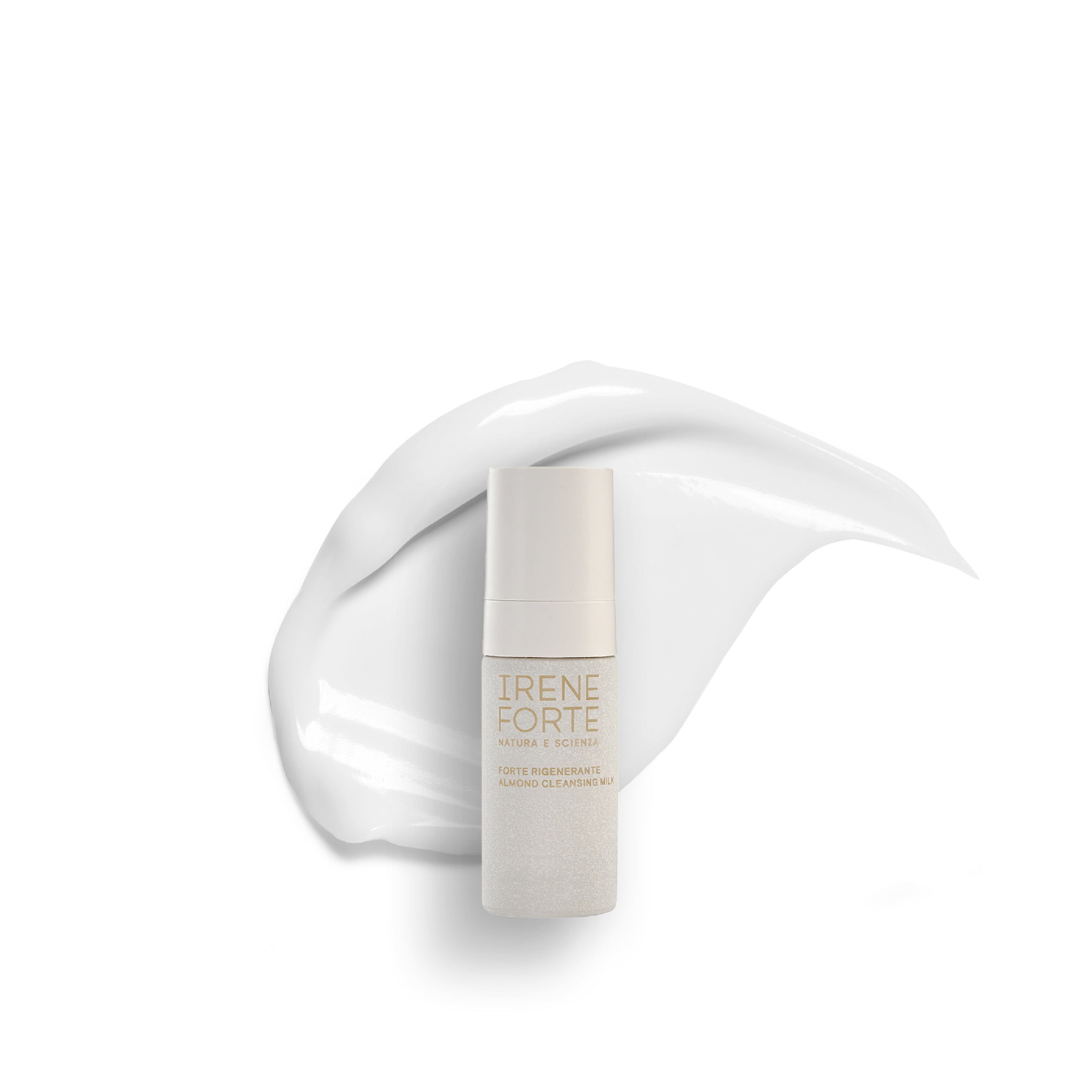 Travel-sized Almond Cleansing Milk packaging on a white background with product texture swatch