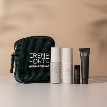 Irene Forte skincare products including a dark green pouch and various bottles on a beige background